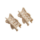 Two beige hair clips on a white background