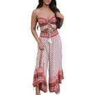 Woman wearing a red and white patterned two-piece outfit on a white background