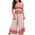 Woman wearing a patterned two-piece outfit on a white background