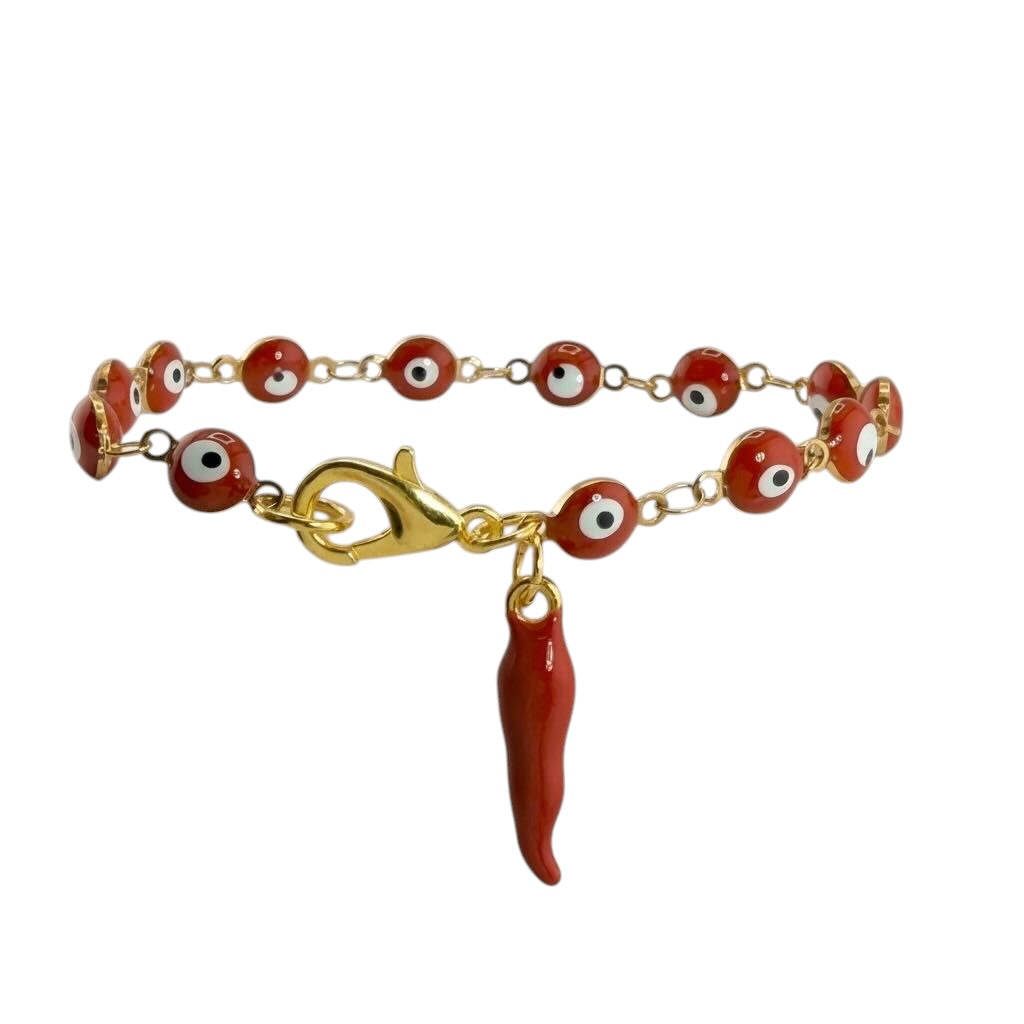 Bracelet with red beads and a gold clasp on a white background