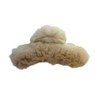Beige fur-like material on a white background