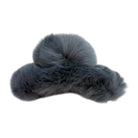 Gray fur-like claw clip on a white background