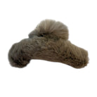 Brown fur clip on a white background