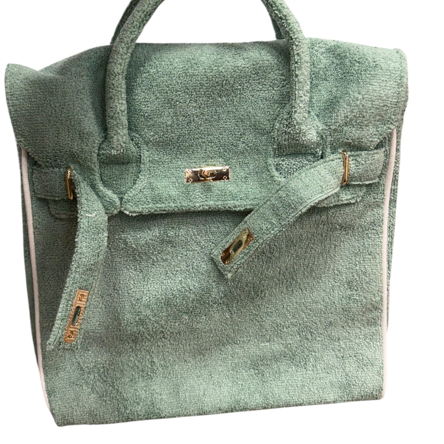 Green textured handbag with gold accents on a white background