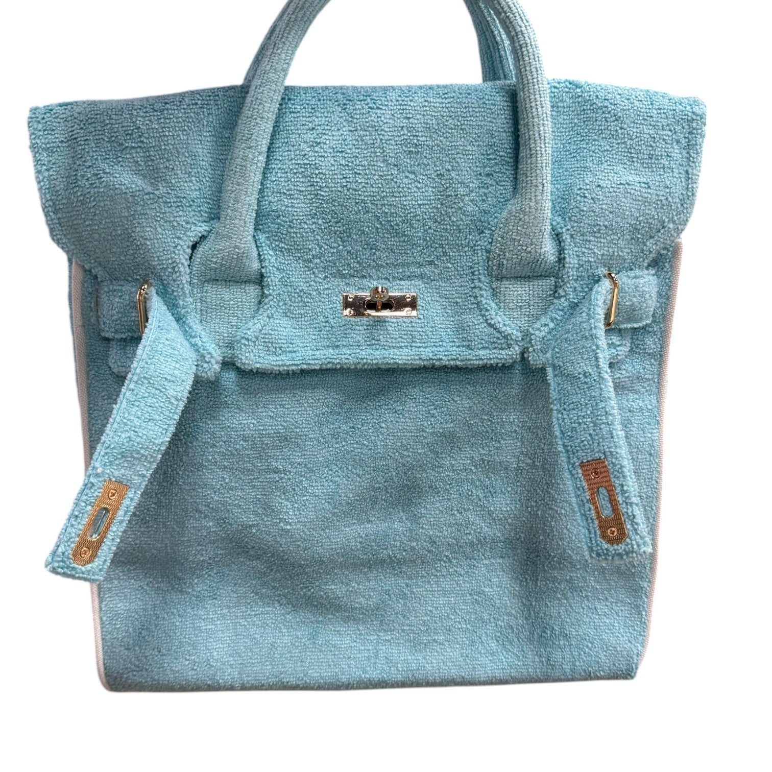 Blue textured handbag with gold accents on a white background