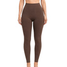 A model wearing high-waisted, form-fitting brown leggings against a plain white background.