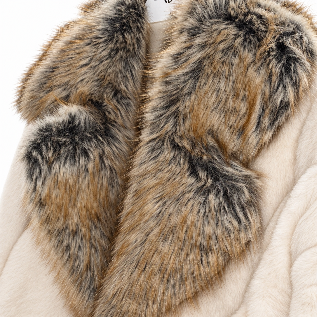 Close-up of a plush cream-colored coat with a large, luxurious shaggy faux-fur collar in mixed brown, gray, and black tones.
