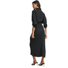 Woman wearing a black dress with a white background