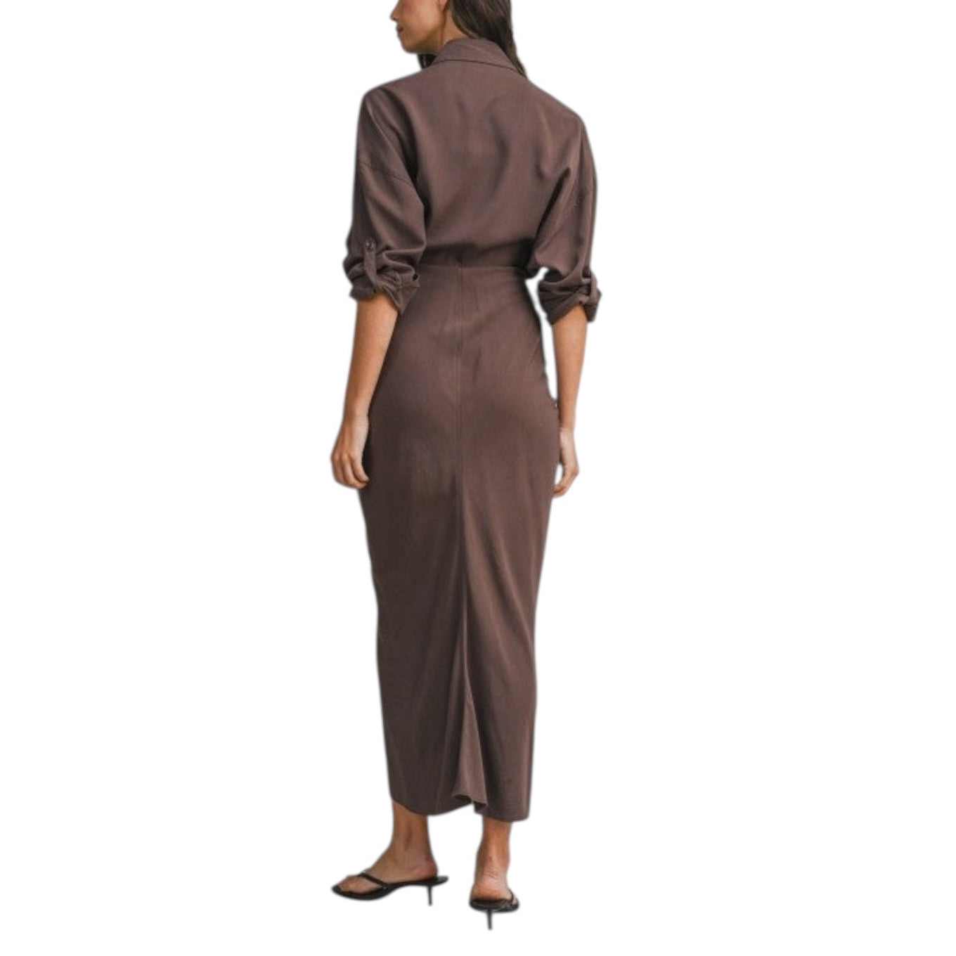 Woman wearing a brown jumpsuit on a white background