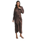 Woman wearing a brown wrap dress on a white background