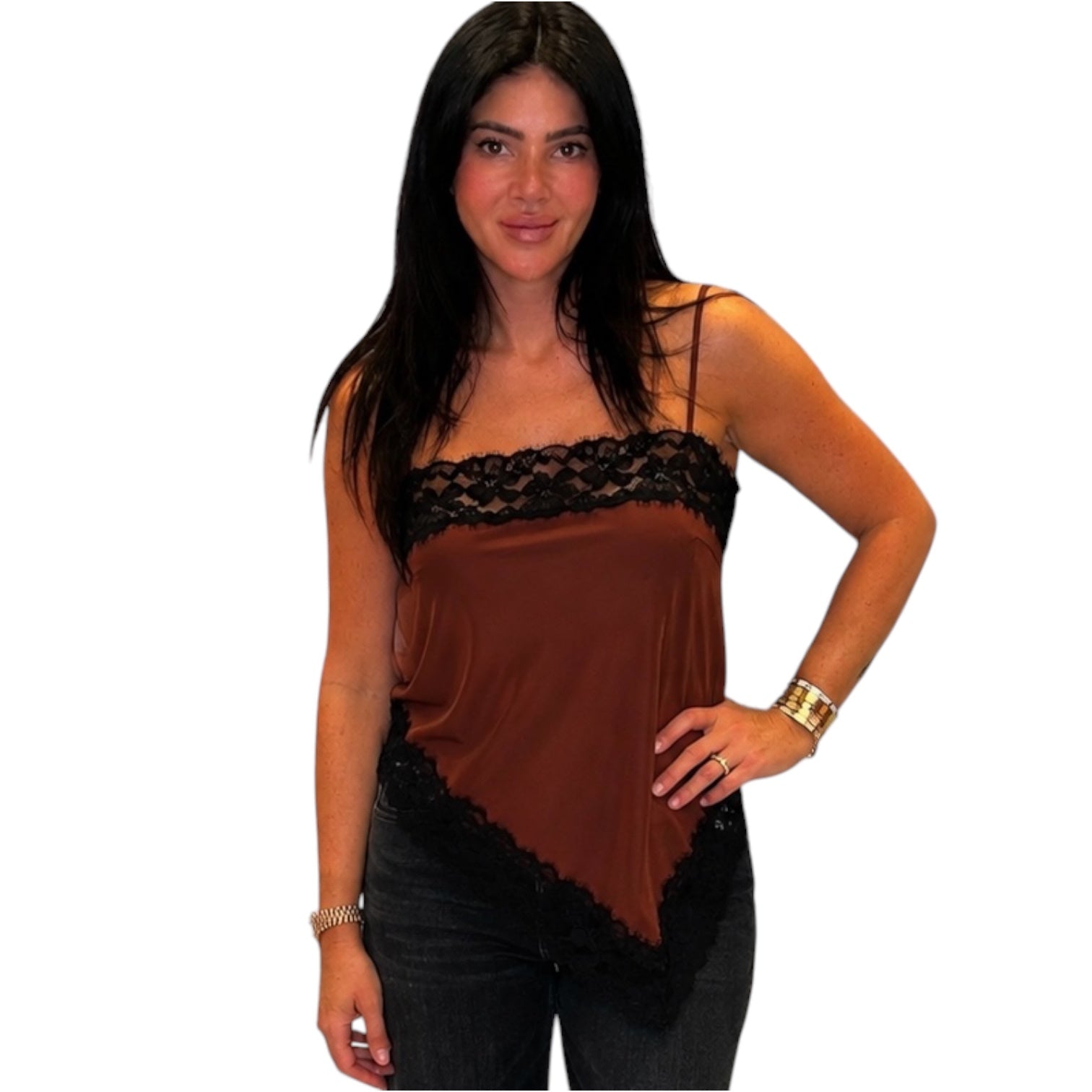 Woman wearing a brown top with lace details on a white background