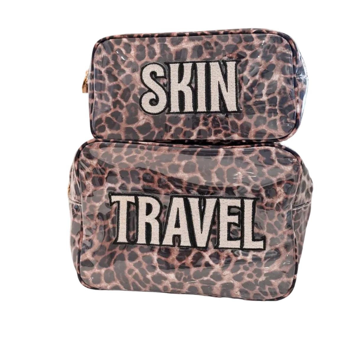 Two leopard-print cosmetic pouches stacked on a white background, labeled 'SKIN' and 'TRAVEL' in bold white letters with black outlines.