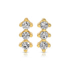 Gold earrings with clear gemstones on a white background