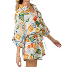 Colorful patterned romper on a white background