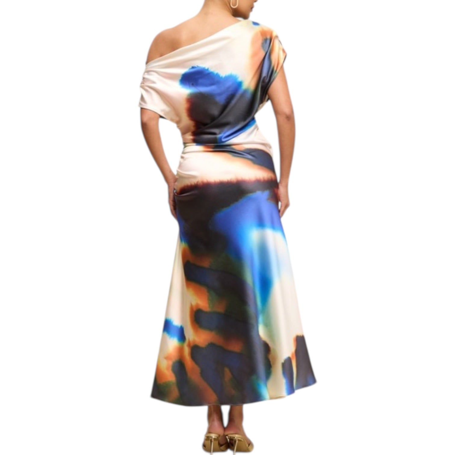 Woman wearing a colorful dress with abstract design on a white background