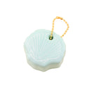 Light blue shell-shaped keychain with gold chain on a white background