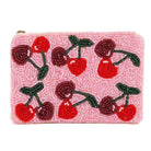 Pink beaded clutch with cherry design on a white background