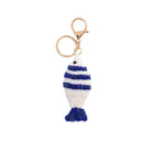 Beaded fish keychain with blue and white stripes on a white background