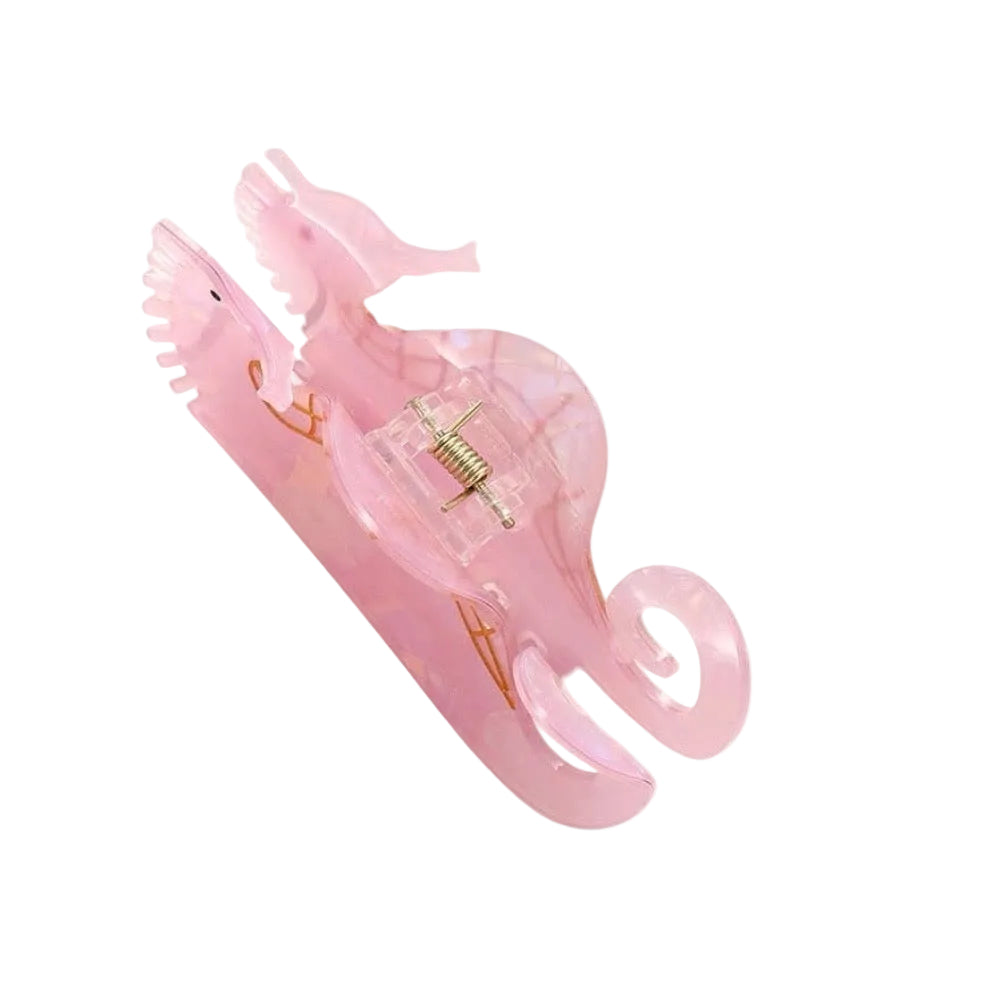 Pink seahorse-shaped inflatable pool float on a white background