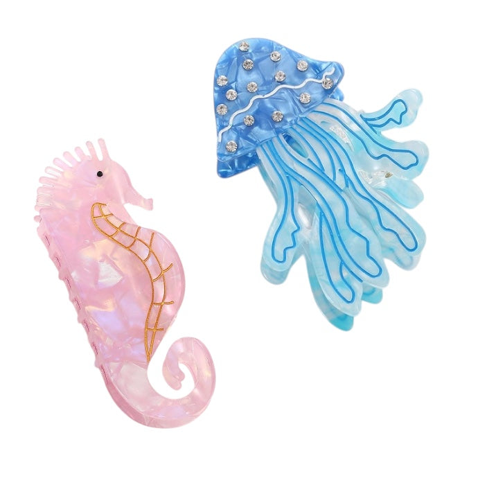 Pink seahorse and blue jellyfish hair clip on a white background