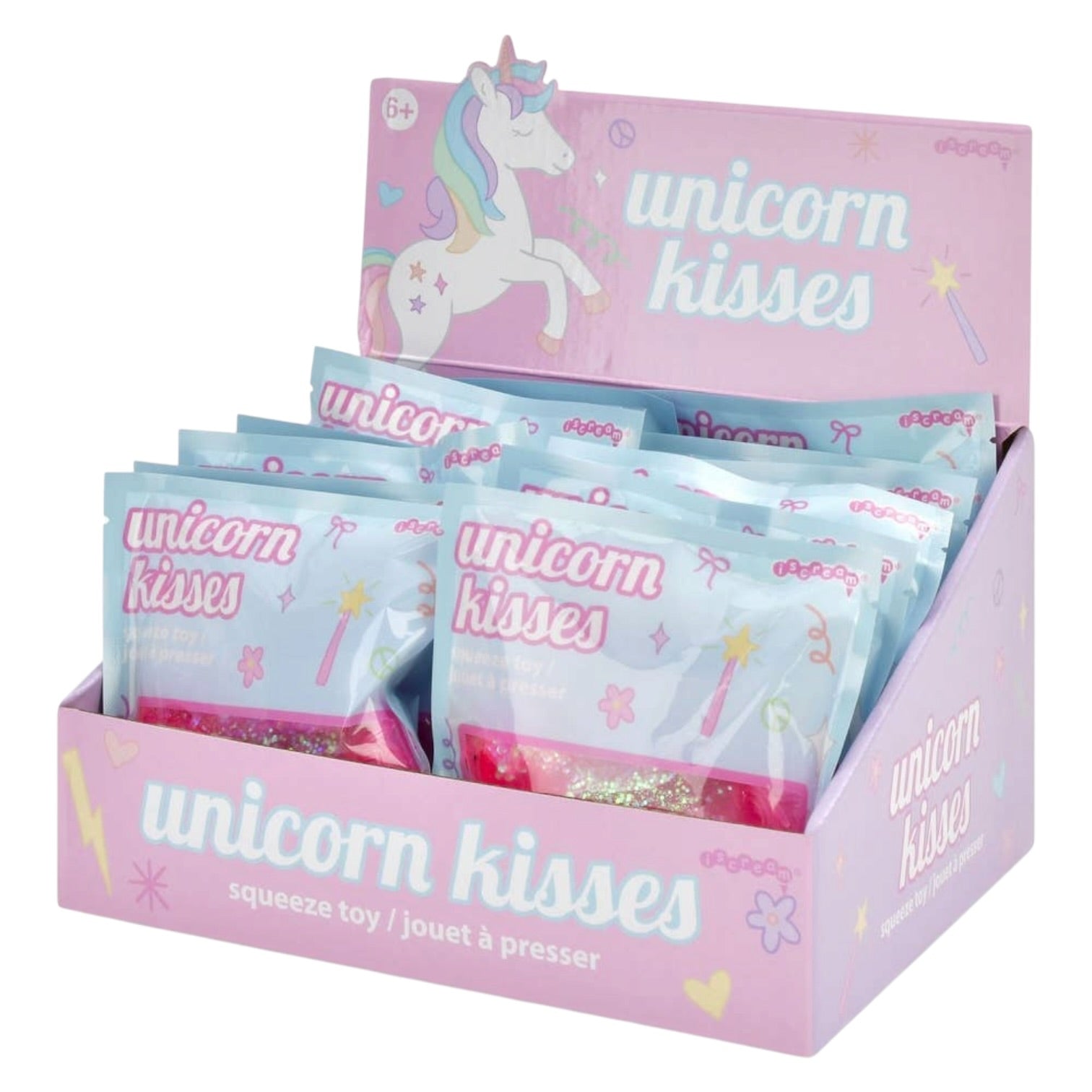 A pink cardboard display box filled with individually wrapped 'unicorn kisses' squeeze toys. The packaging features pastel blue and pink bags with unicorn illustrations and the words 'unicorn kisses' printed on them.