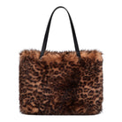 A leopard print faux fur tote bag with black shoulder straps, shown against a plain white background.