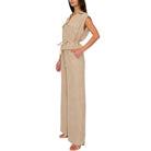 Woman wearing a beige set on a white background