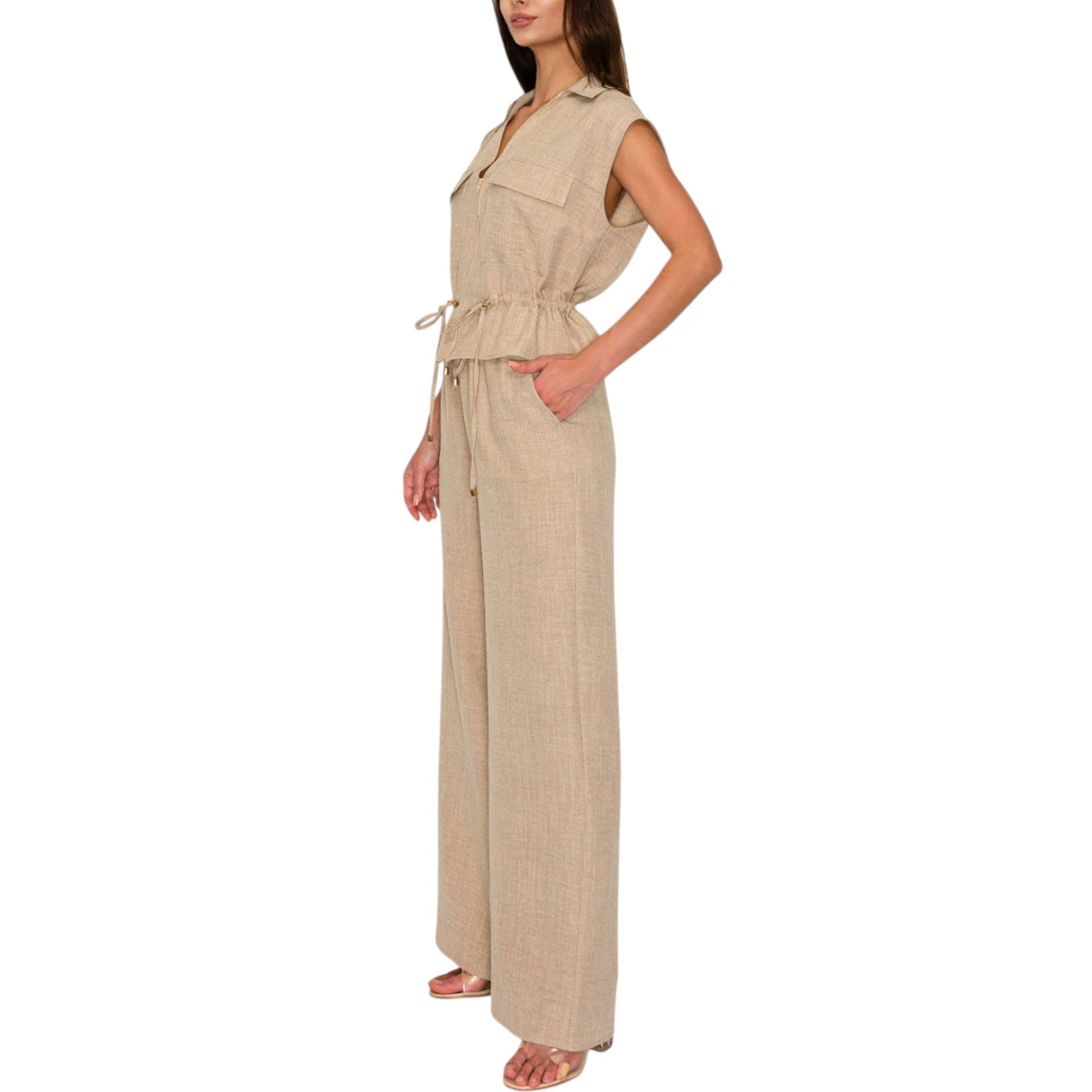 Woman wearing a beige set on a white background