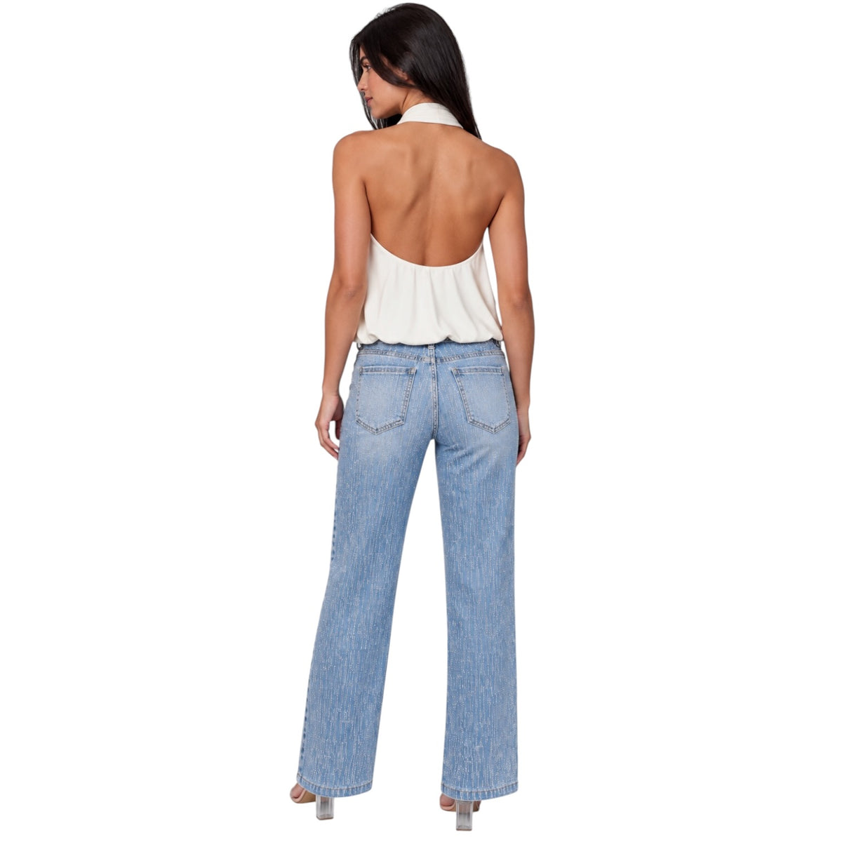 A woman shown from the back wearing a light blue wide-leg denim jeans and a white halter top, photographed against a solid white background.