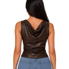 A woman shown from the back wearing a sleeveless cowl-neck top in dark brown faux leather, paired with blue jeans, against a plain white background.