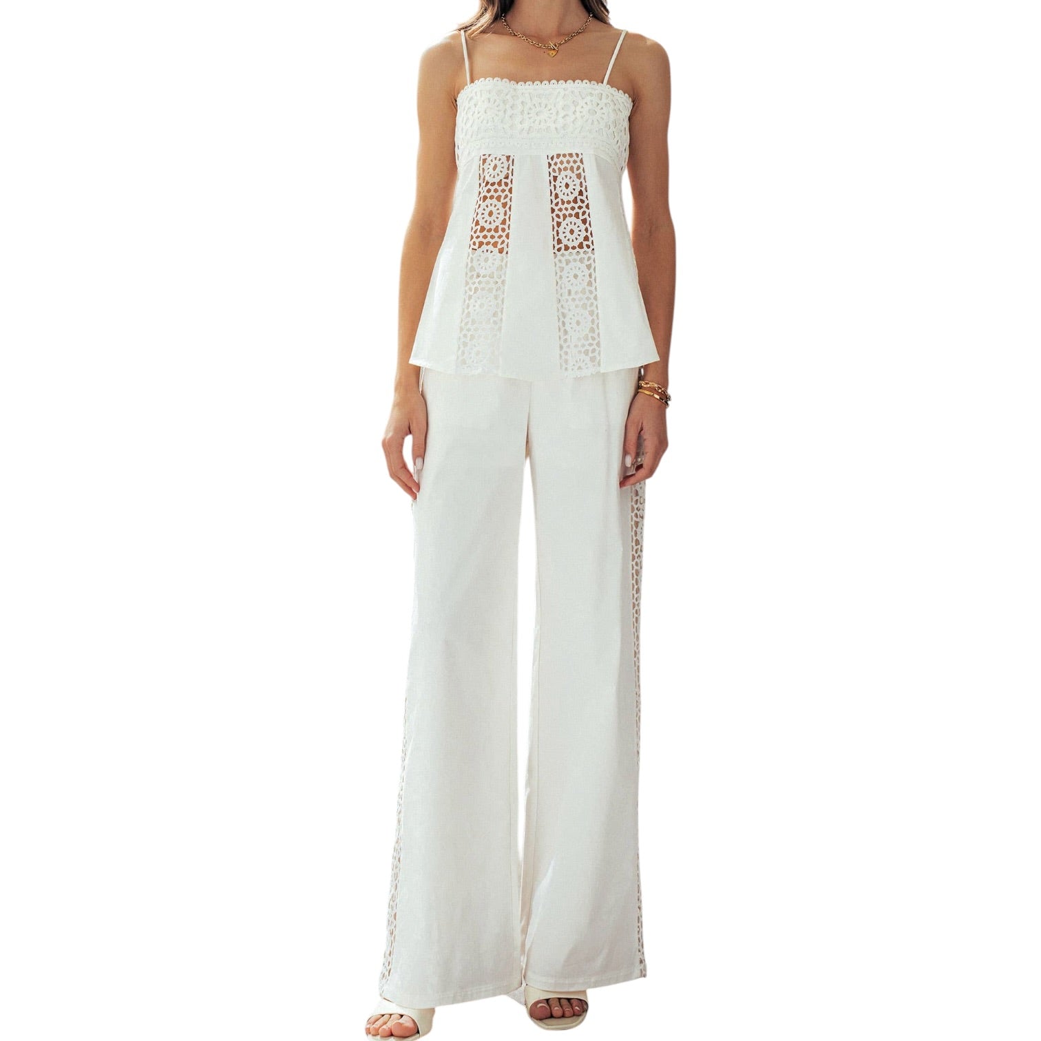 White lace top and wide-leg pants on a white background