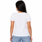 A woman viewed from the back wearing a plain white short-sleeve crewneck t-shirt and light blue jeans, set against a solid white background.