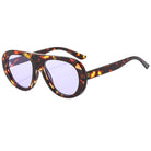 Sunglasses with tortoiseshell frame and purple lenses on a white background