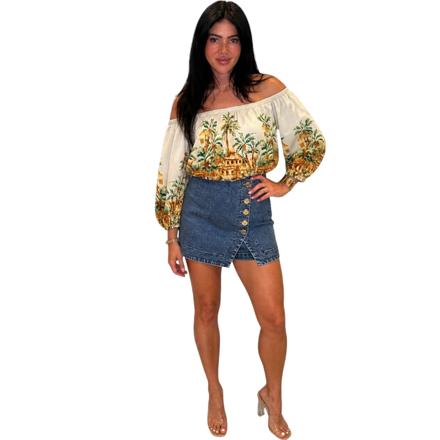 woman wearing denim skort with gold buttons on white background