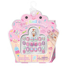 A packaged set of cute, pastel-colored press-on nails and matching rings in a pink cupcake-shaped box. The nails feature various cartoon characters, desserts, and sprinkles in pink, purple, blue, and white.