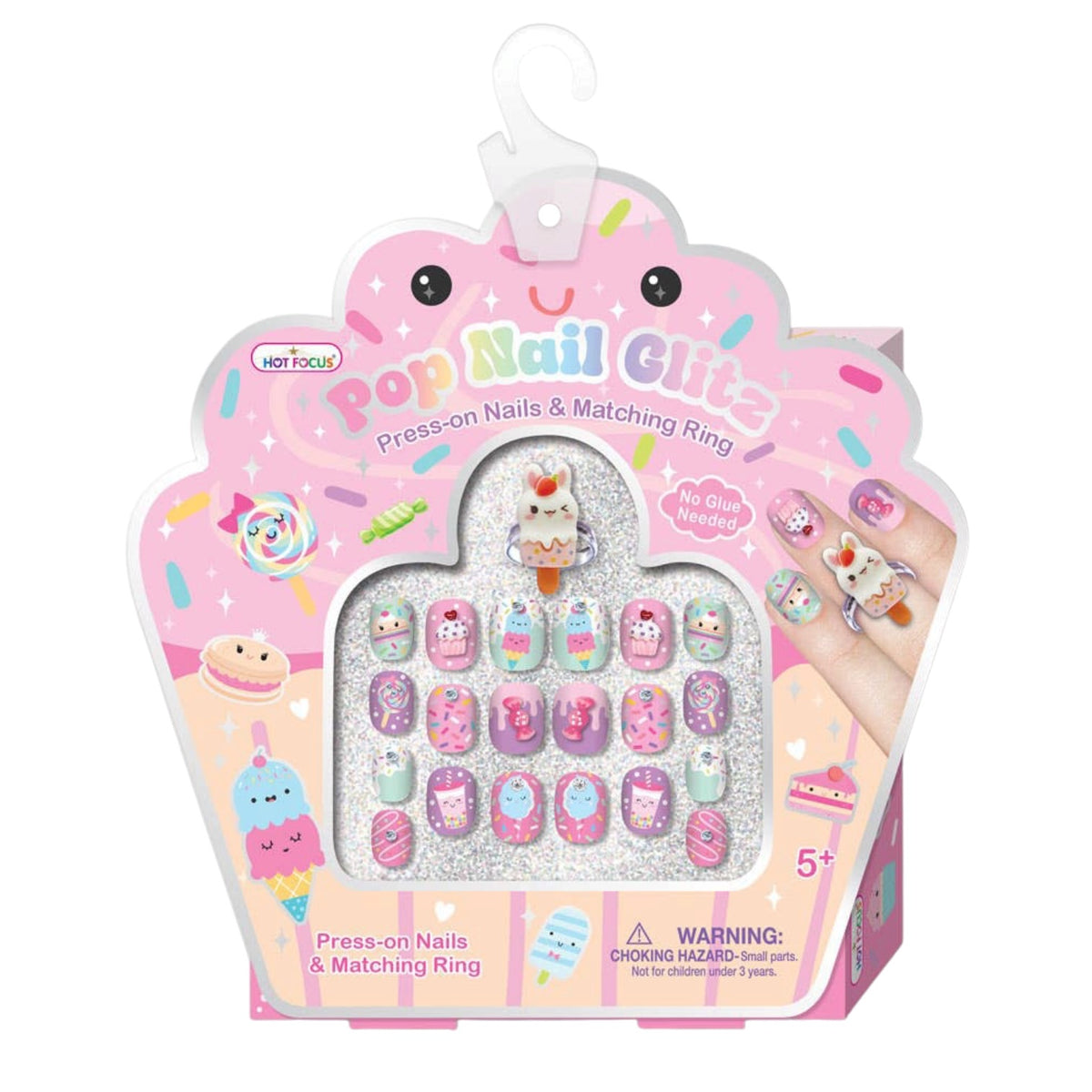 A packaged set of cute, pastel-colored press-on nails and matching rings in a pink cupcake-shaped box. The nails feature various cartoon characters, desserts, and sprinkles in pink, purple, blue, and white.
