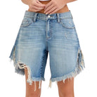 Denim shorts with frayed edges on a white background