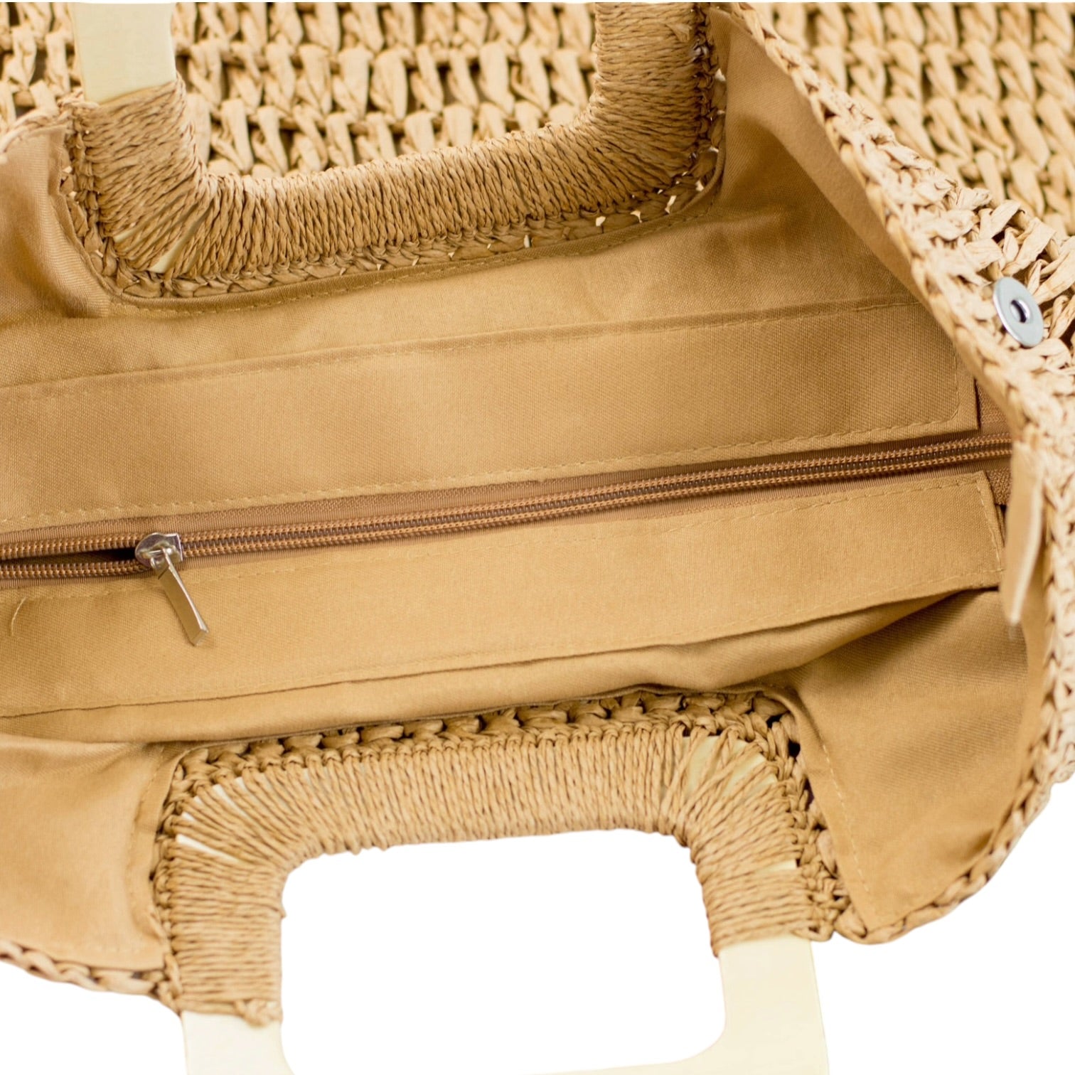 Close-up of a tan woven handbag with a zipper.