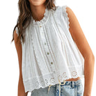 a woman wearing a white eyelet button down tank top on white background