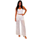 Woman wearing a white lace pants on a white background