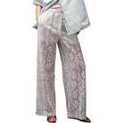 Lace pajama pants worn by a person on a white background