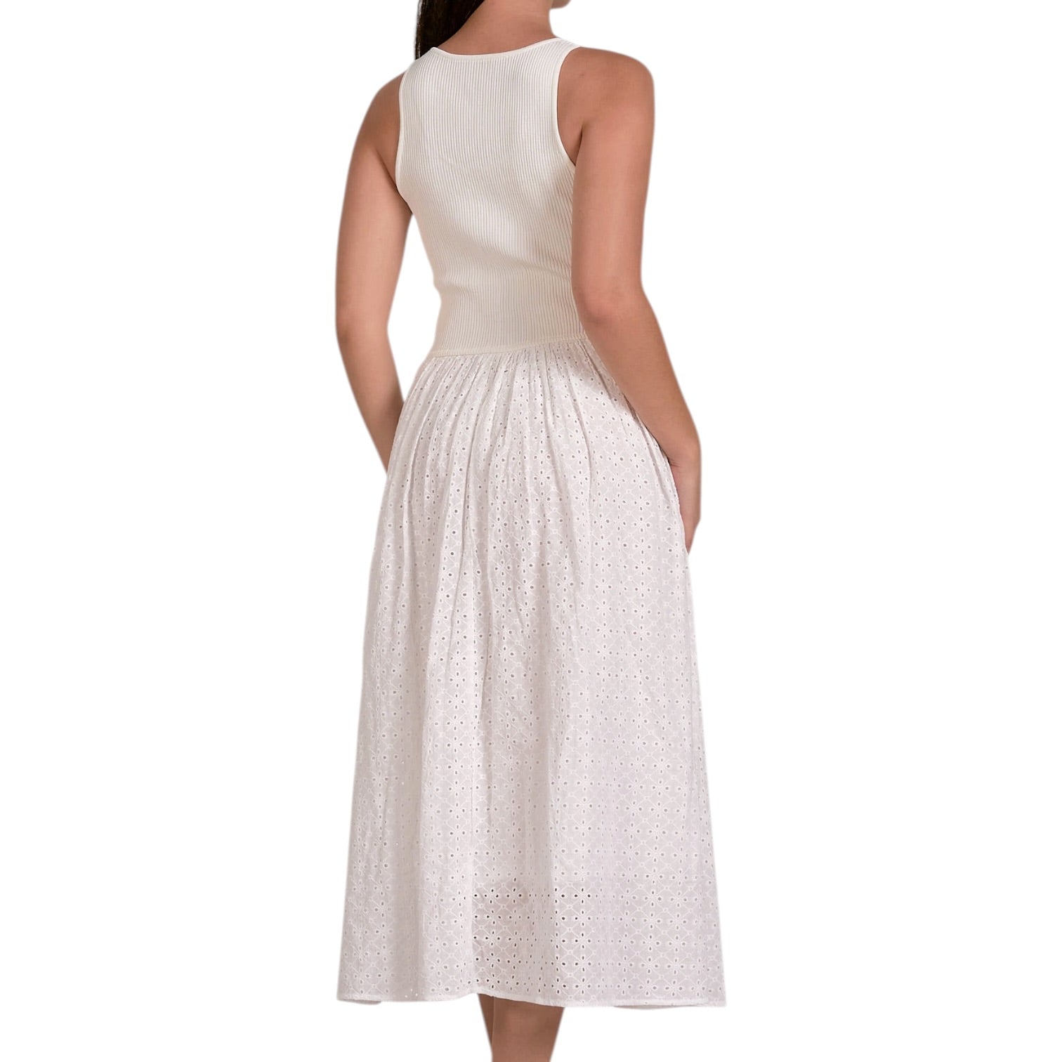 White sleeveless dress with lace detailing on a white background