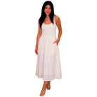 Woman wearing a white dress on a white background