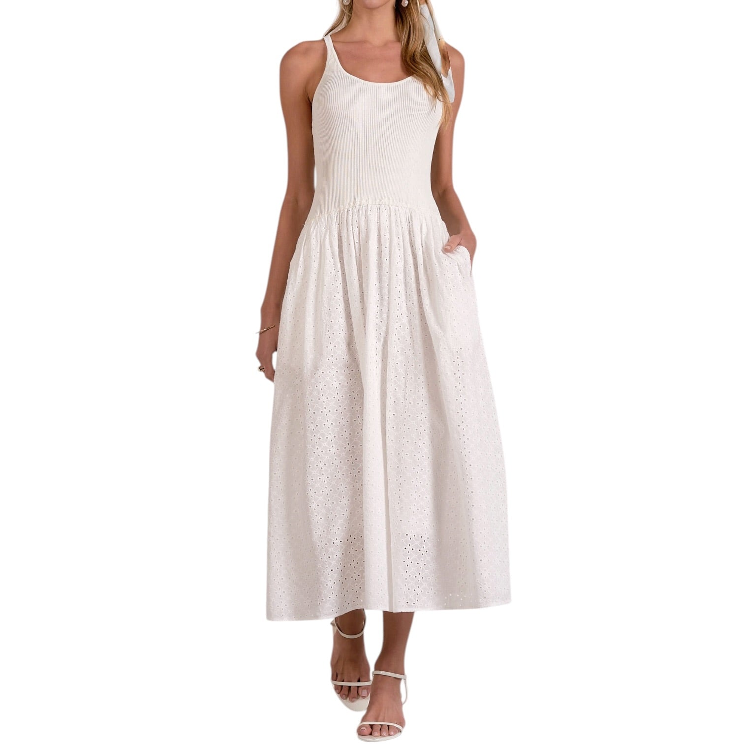 White sleeveless dress worn by a model on a white background