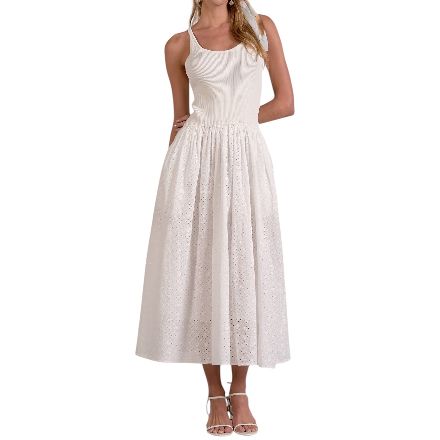 White sleeveless dress worn by a model on a white background