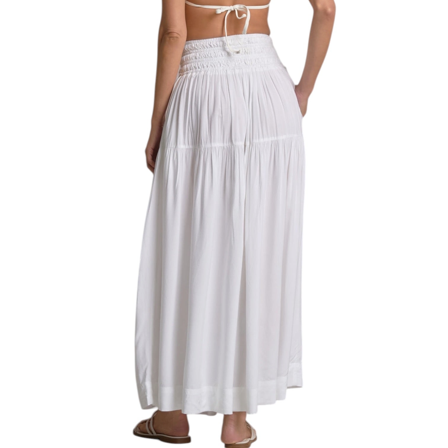 White long skirt worn by a person on a white background