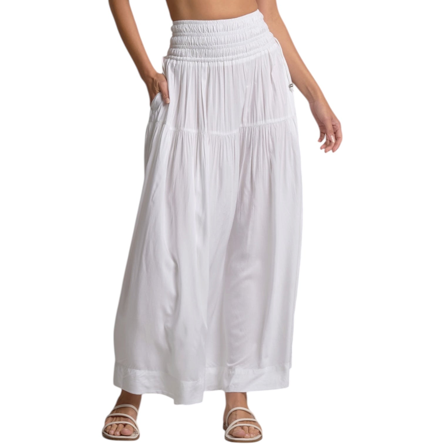 White maxi skirt worn by a person on a white background