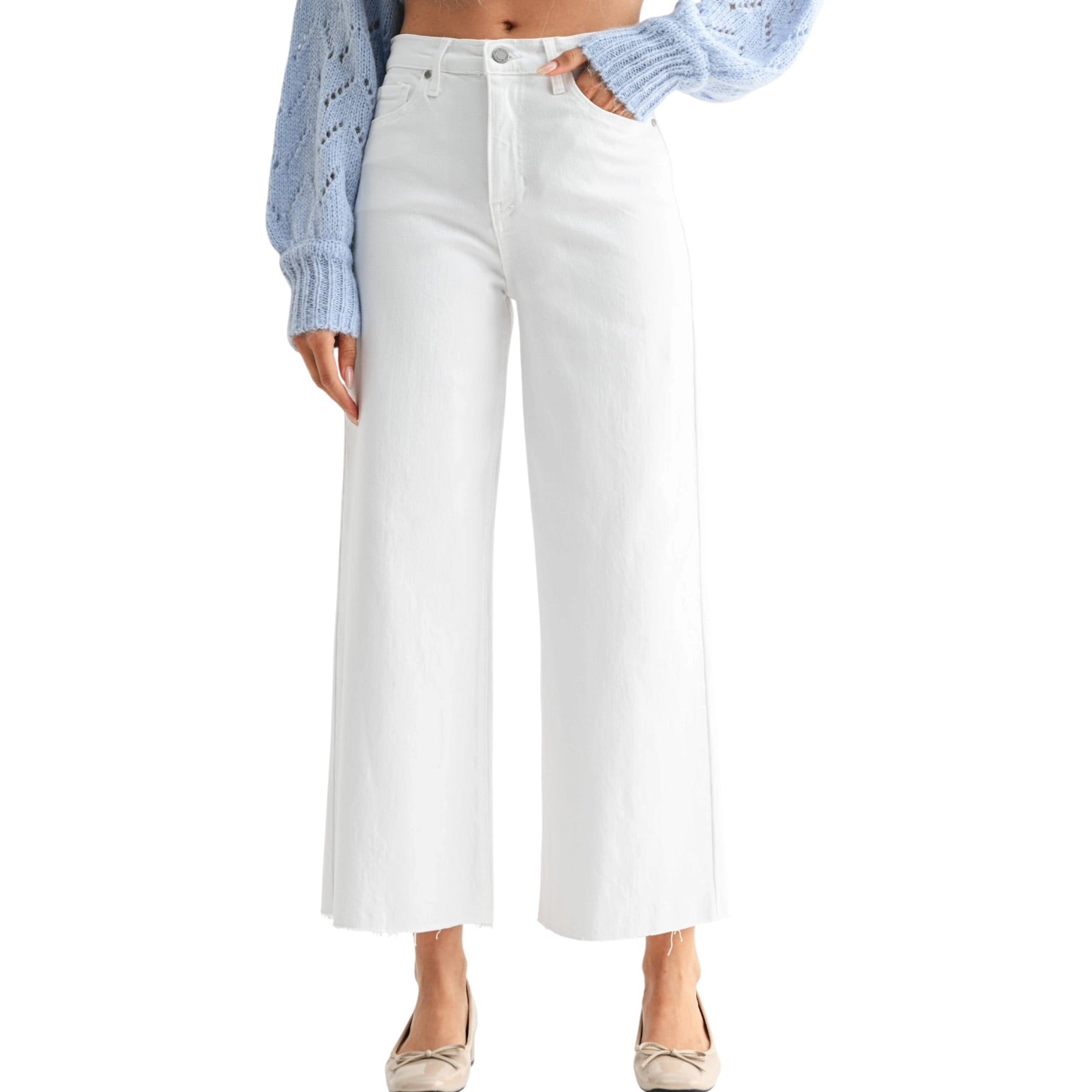 White wide-leg jeans worn by a person on a white background