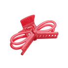 Red hair clip on a white background