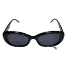 Black sunglasses with dark lenses on a white background